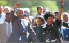 Nelson Mandela, accompanied by his then wife Winnie, walks free from prison on February 11 1990
